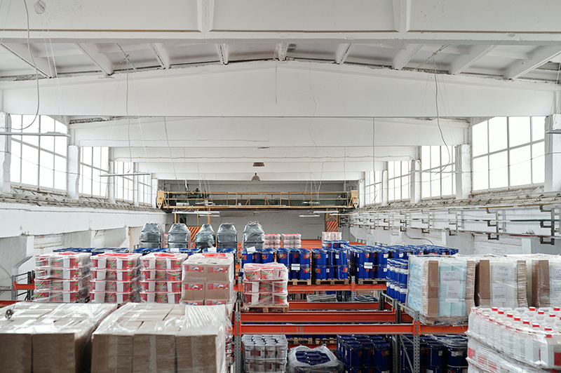 Photo of a warehouse with consumer products on skids